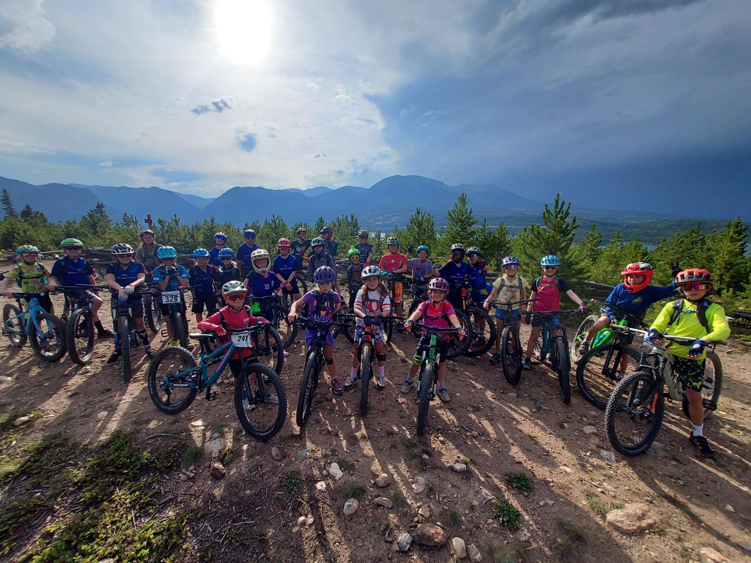 team summit mountain bike team above frisco co with their bikes at sunset